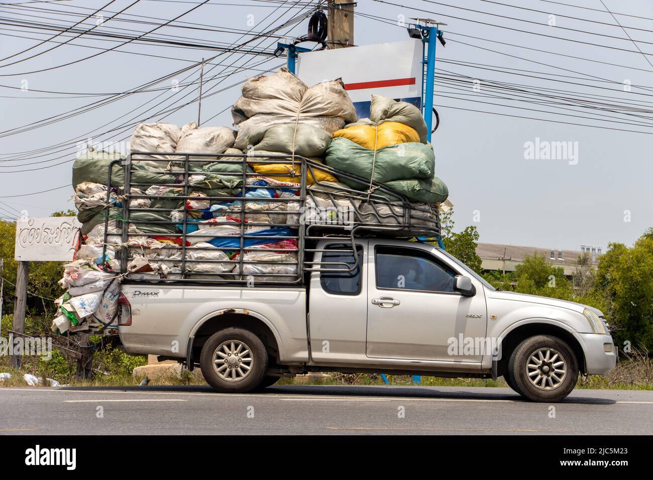 bangkok-thailand-june-01-2022-a-pick-up-car-loaded-with-many-sacks-ride-on-a-road-2JC5M23.jpg