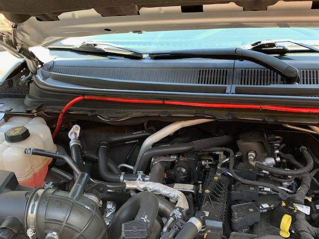 Amp wire across engine.jpeg