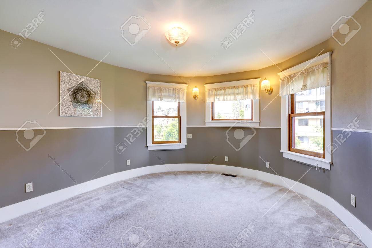 34256628-empty-room-with-round-corner-in-light-grey-tones-with-three-windows-and-carpet-floor.jpg