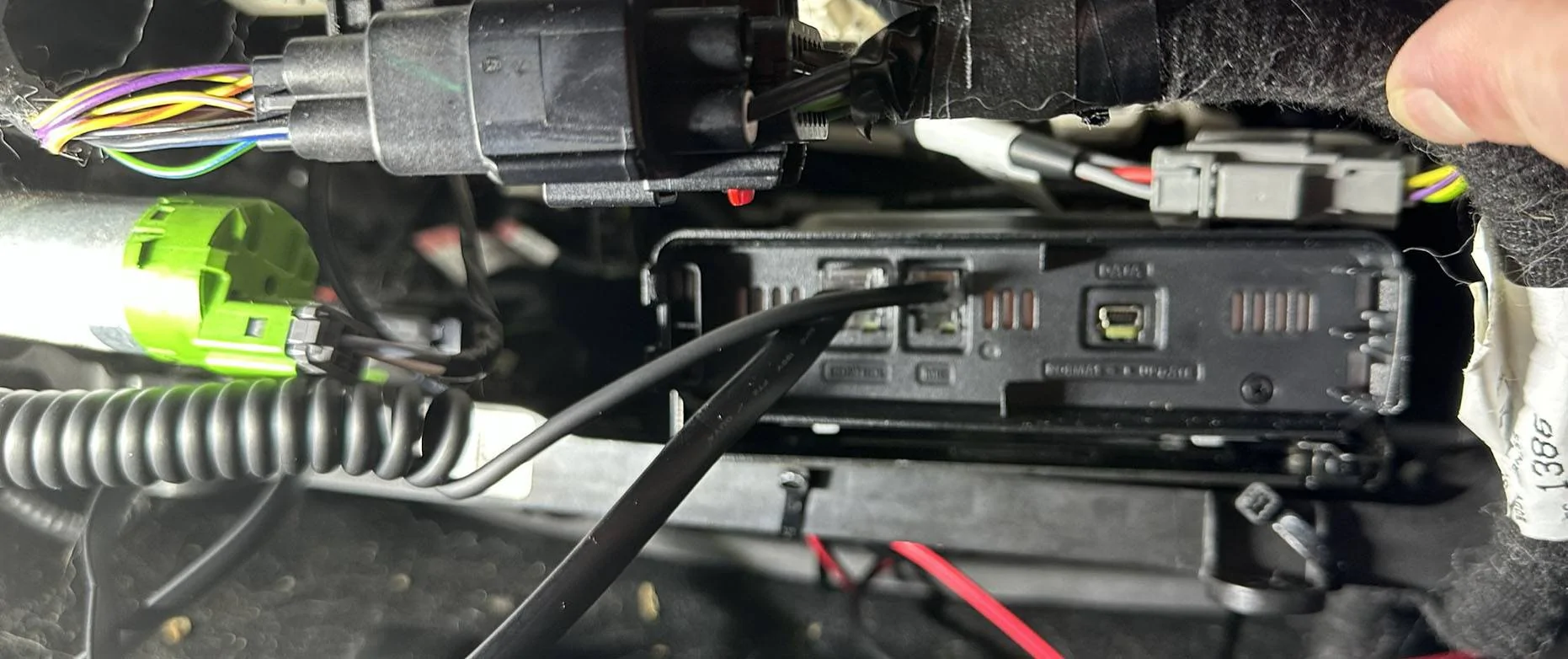 Radio mounted under driver seat.webp