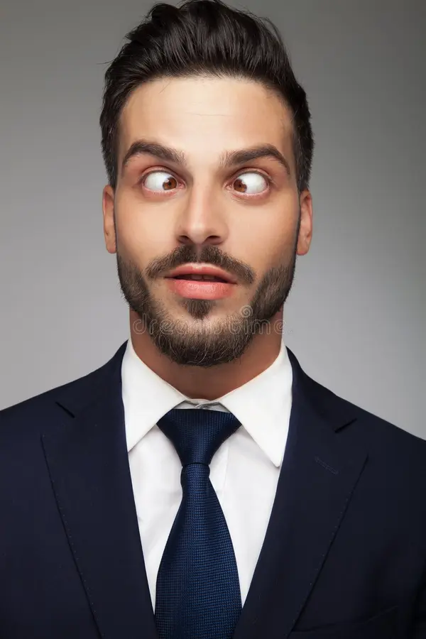 young-cross-eyed-business-man-smiling-young-cross-eyed-business-man-smiling-grey-background-1...webp