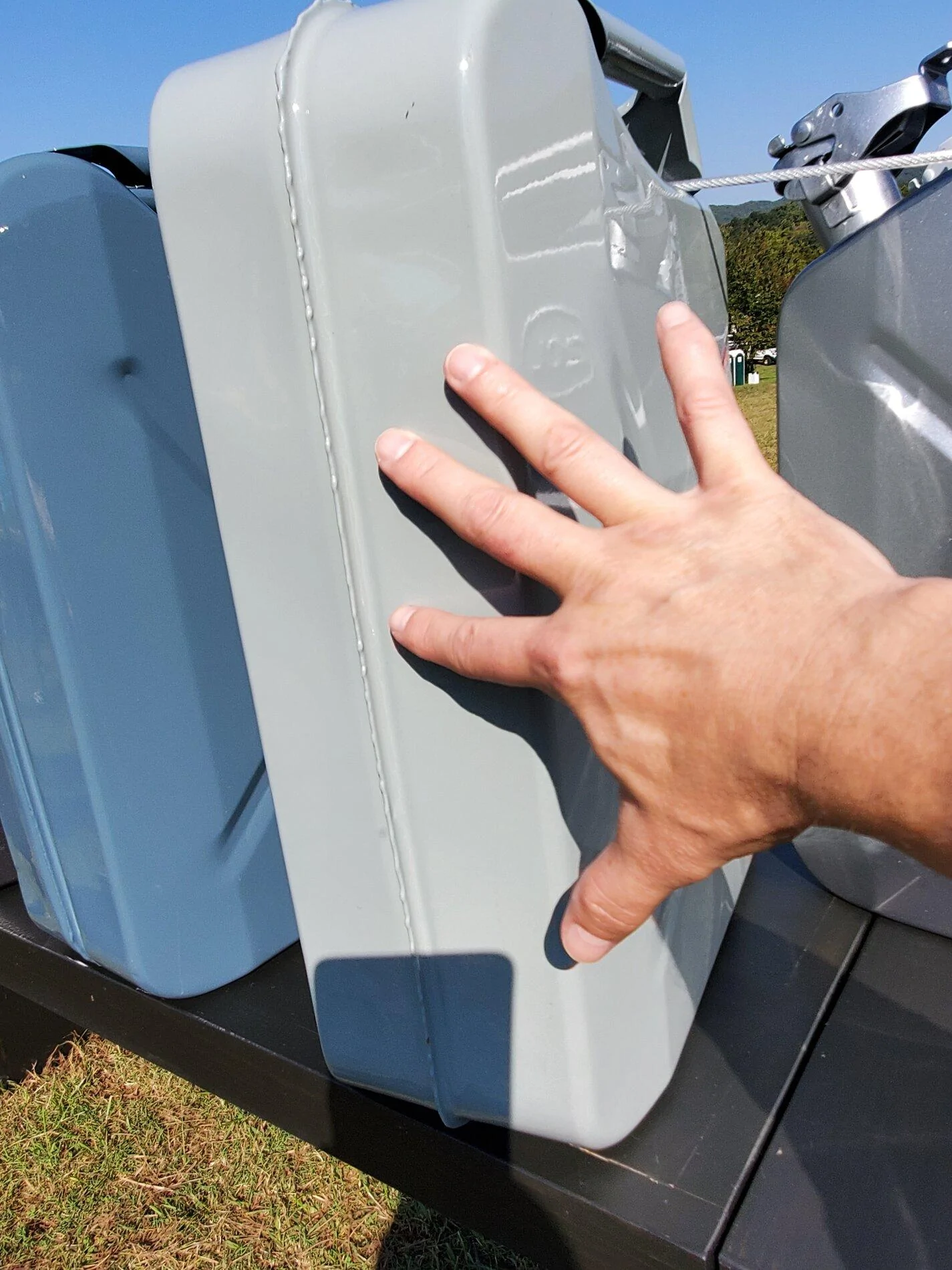 can next to hand in direct sun.webp
