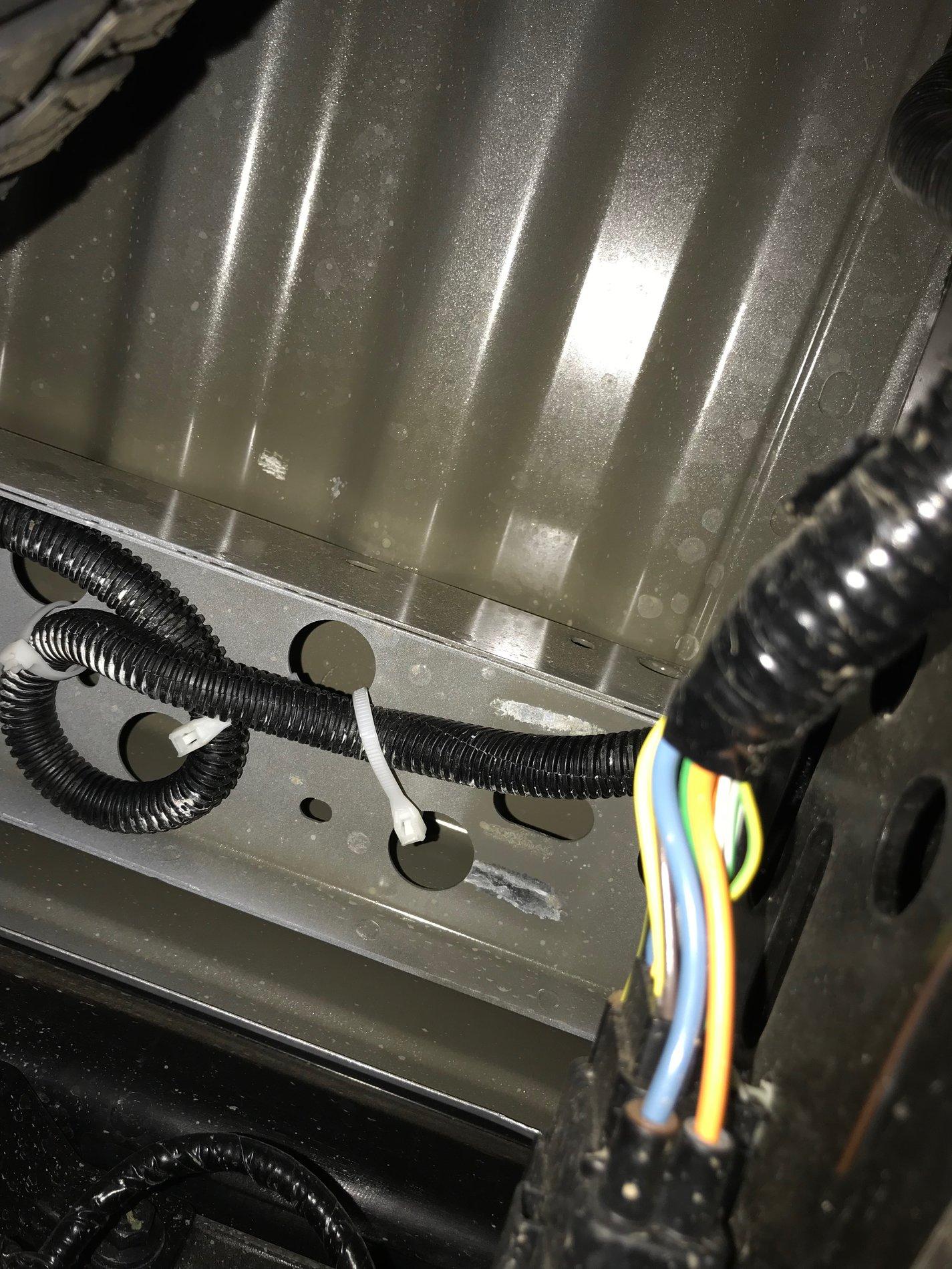 Driver side inside frame rail connecting into 12V supply and passenger LED and driver LED wires.JPG