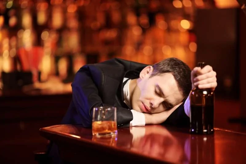 young man passed out bar.jpg